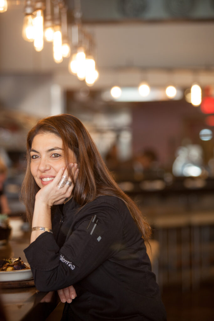 chef valentina guolo migotto beauty shot, sitting at bar