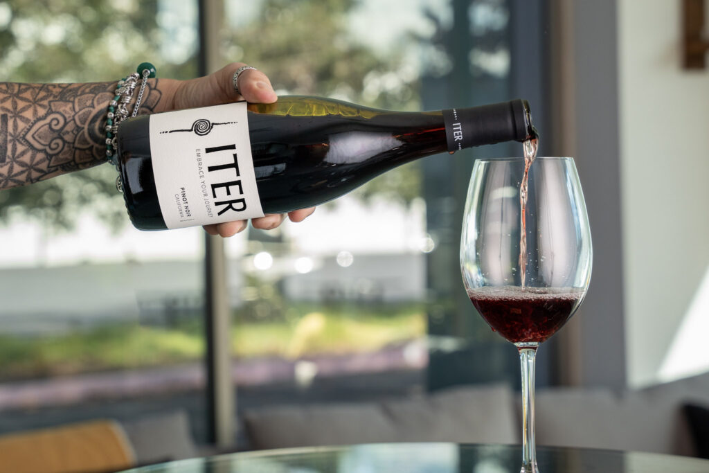 Iter Pinot Noir California pouring into wine glass